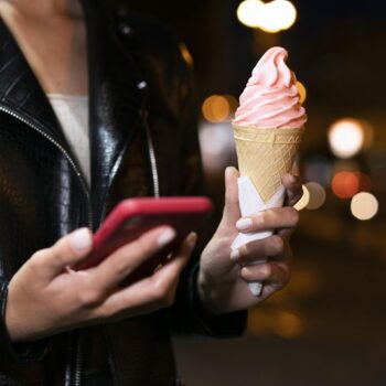 close-up-hands-holding-ice-cream-phone